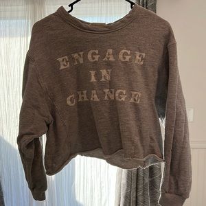 Woman’s grey graphic crop crewneck sweater